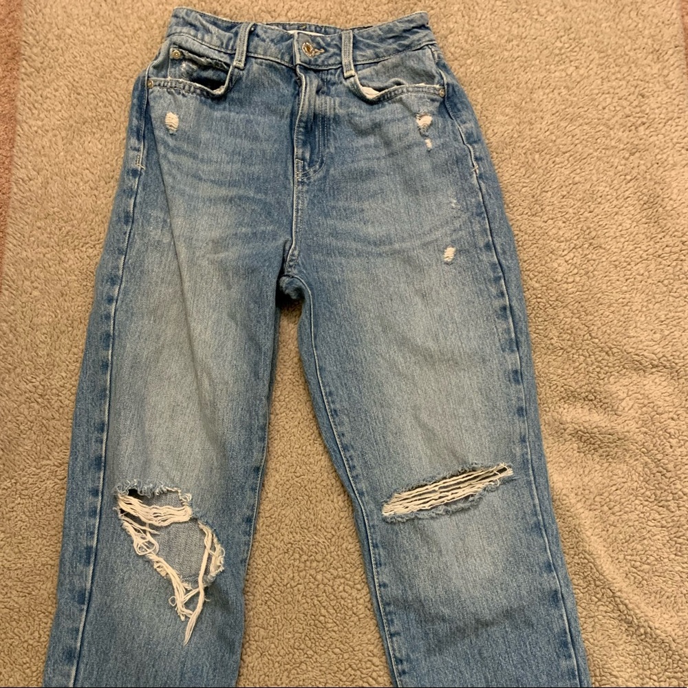 Zara mom jeans. The waist is true to size and does not stretch. Too tight for me